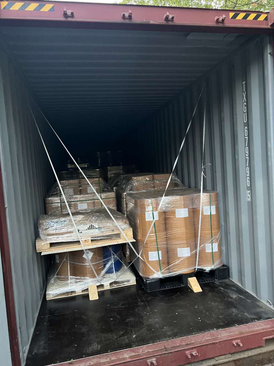 Palletized chemical goods secured inside a shipping container